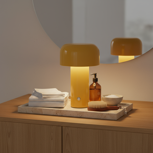 Yellow lamp on a tray with towels and accessories