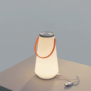 Portable lamp with a USB cable on a neutral background