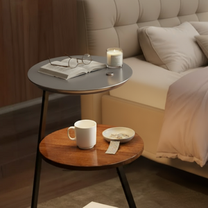Cozy bedroom with a bed, side tables, and reading materials.