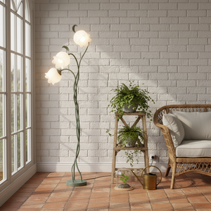 Decorative floor lamp in a room with a white brick wall, wicker chair, and small wooden shelf with plants.