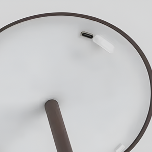 Top view of a wireless earbud in a charging case on a light gray background