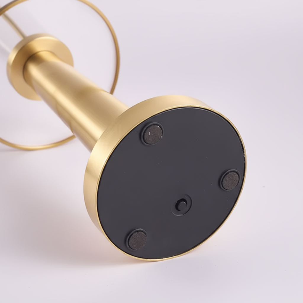 Gold and black door stopper on a white background