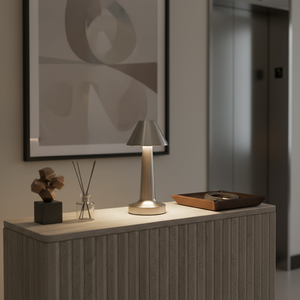 Modern interior with a table lamp, decorative items, and abstract art on the wall.