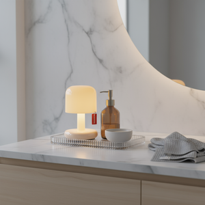 Small lamp on a marble countertop with a neutral background