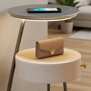 Round side table with a beige clutch on top in a living room setting
