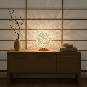 Decorative lamp on a wooden console table with a subtle background