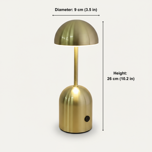 Gold table lamp with measurements on a white background