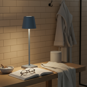 Nautical-themed room with a lamp, book, and glasses on a wooden surface.
