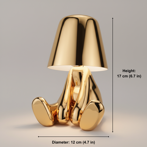 Gold-colored lamp with dimensions indicated on a gray background