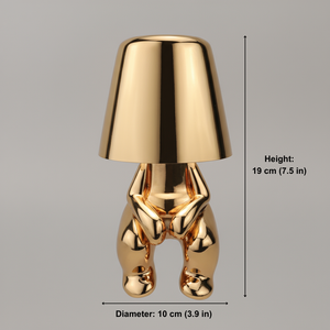 Gold-colored lamp with dimensions on a gray background