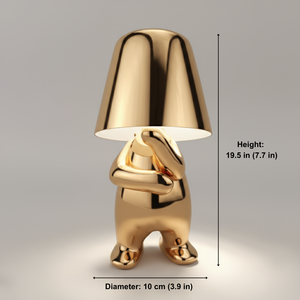 Gold-colored lamp with dimensions indicated on a gray background