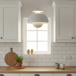 Modern kitchen with white cabinets, wooden countertop, and pendant light.