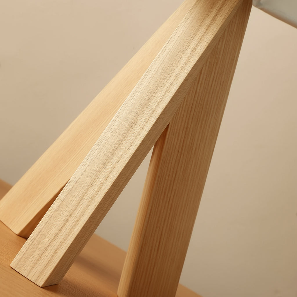Close-up of a wooden chair with a neutral background