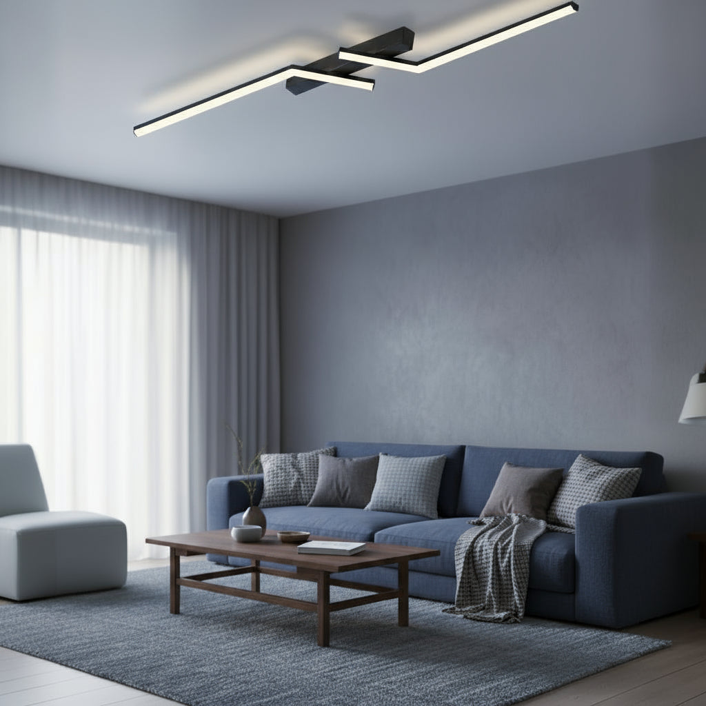 Modern living room with a blue sofa, wooden coffee table, and ceiling lights.