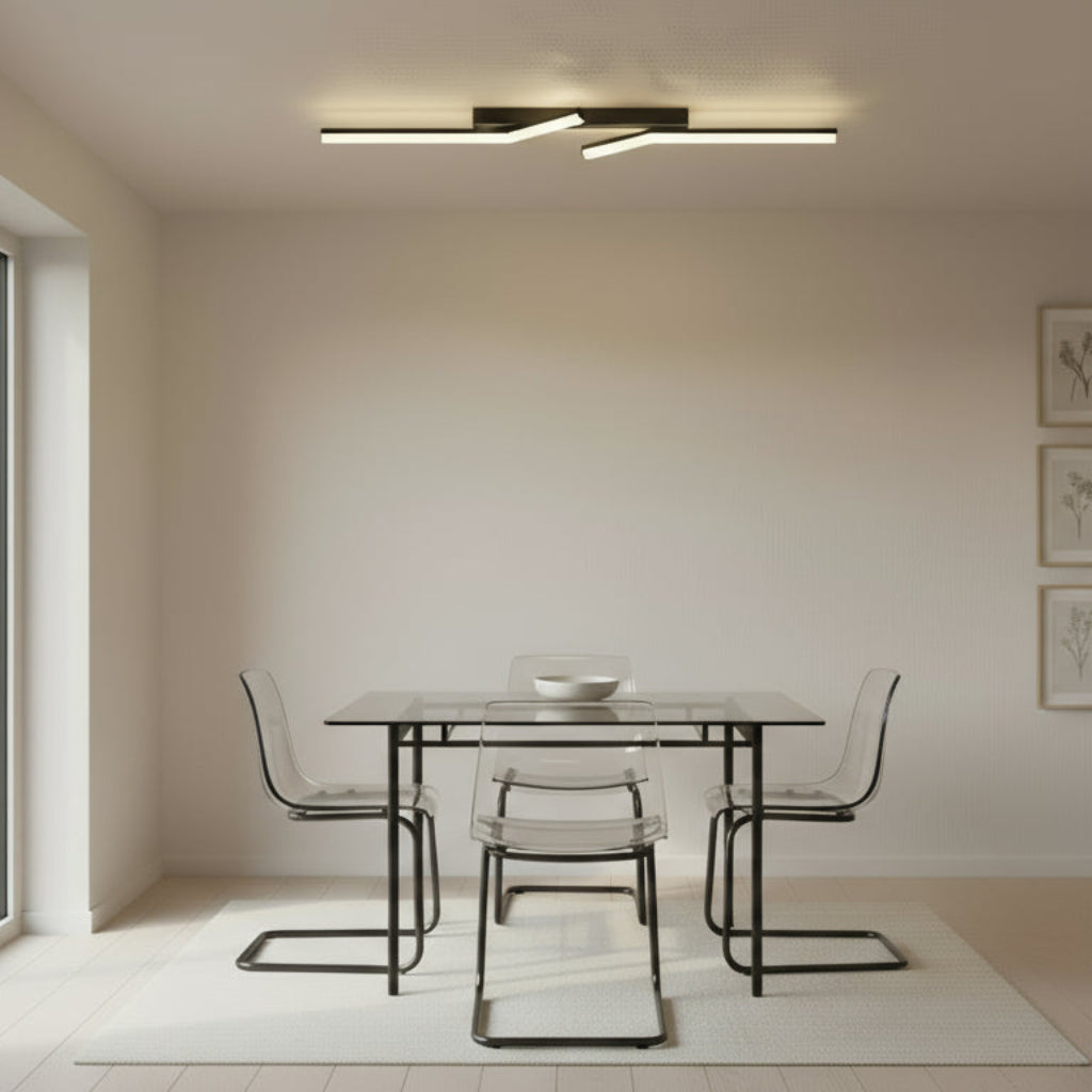 Modern dining room with a glass table and chairs in a minimalistic setting.